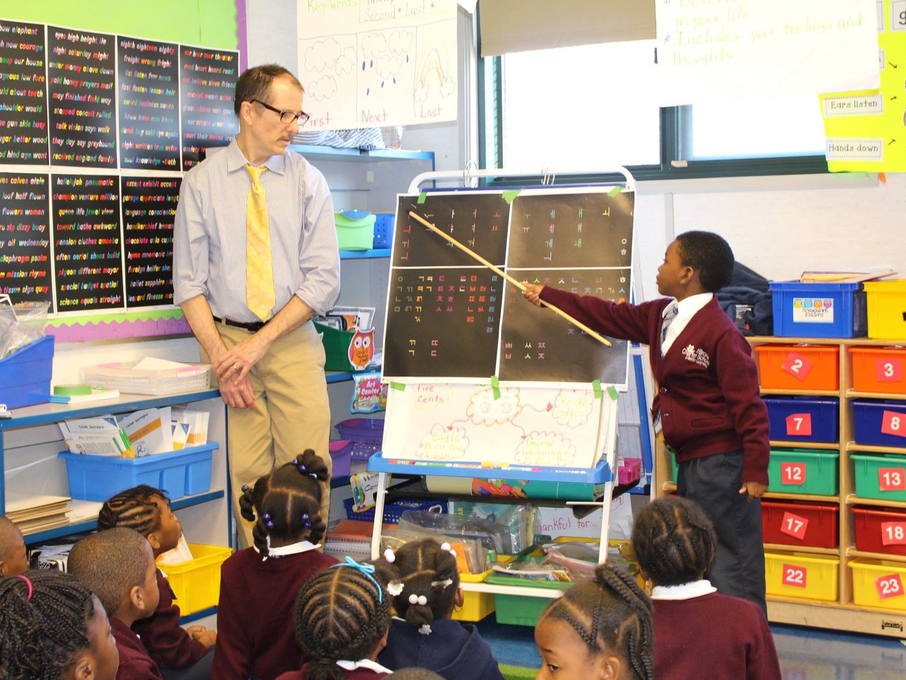 Bruce Ballard teaching students how to read Korean using Silent Way at Bronx Charter School for Better Learning.